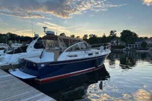 2001 Legacy Yachts 34 Express stern quarter profile showing transom, swim platform, and aft deck layout in New London, CT.