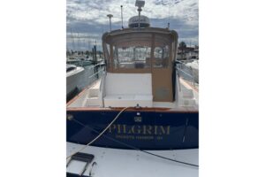 2001 Legacy Yachts 34 Express cockpit and helm area showing seating, steering console, and express cruiser layout
