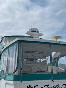 Galley with stainless steel appliances and wood cabinetry in 2002 Silverton 392 Motor Yacht.
