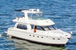 2005 Carver 560 Voyager 56-foot motor yacht flybridge or upper deck area with seating and helm station visible against ope...