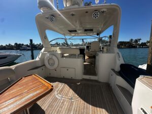 2006 Chris-Craft Roamer 40 salon with upholstered seating, overhead lighting, and cabin access in Miami Beach.