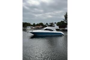2006 Sea Ray 44 Sedan Bridge stern quarter profile showing swim platform, transom, and bridge deck layout in Miami, FL