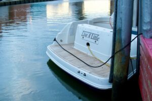 2006 Sea Ray 44 Sedan Bridge flybridge deck and helm station with dual captain's chairs and wraparound seating overlooking...