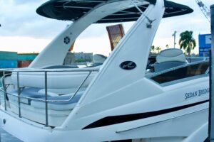 2006 Sea Ray 44 Sedan Bridge flybridge helm station with dual seating, wraparound views, and upper deck controls overlooki...