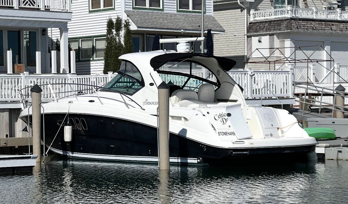 2007 Sea Ray 38 Sundancer cruiser with white hull and hardtop shown in profile at Stone Harbor, New Jersey.