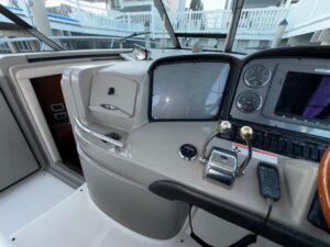 Sea Ray 38 Sundancer cabin interior with salon seating, upholstered furnishings, and natural lighting from windows.