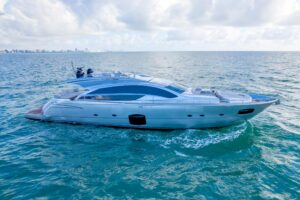2013 Pershing 82 flybridge deck with helm seating, wraparound windscreen, and open-air lounge area overlooking the foredec...