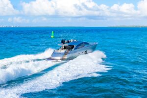 2013 Pershing 82 flybridge deck with helm station, seating, and open-air layout overlooking the water in Miami