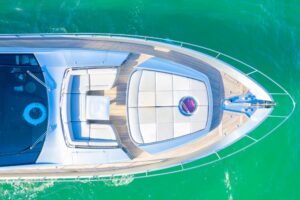 2013 Pershing 82 flybridge deck seating and helm station with wraparound views over Miami waters