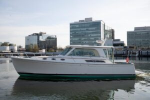 2014 Back Cove 37 cruising yacht showing starboard bow profile with hardtop and cabin windows underway.