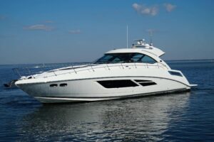 2014 Sea Ray Sundancer 540 54-foot express cruiser full port-side profile underway in open water, Destin Florida