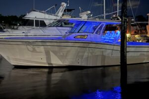 2015 Grady-White Canyon 376 39-foot center console seen from stern quarter angle showing transom, swim platform, and outbo...