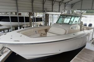 2015 Grady-White Canyon 376 center console cockpit seating and helm station area with hardtop overhead on a 39-foot offsho...