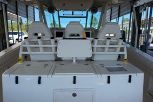 2015 Grady-White Canyon 376 center console cockpit seating and helm area with hardtop overhead on a 39-foot offshore fishi...