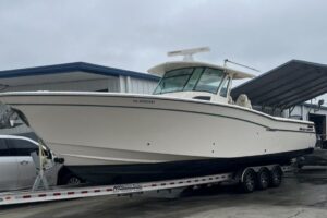 2015 Grady-White Canyon 376 center console cabin interior showing forward berth seating area and sleeping accommodations a...