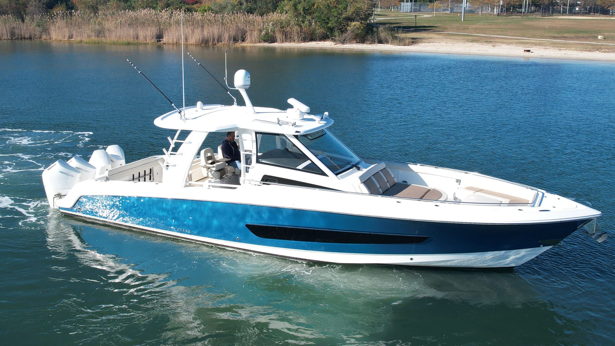 2017 Boston Whaler 420 Outrage 42-foot center console fishing yacht shown in full starboard profile at dock in Freeport, N...