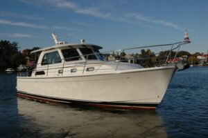 2019 Sabre 38 Salon Express 38-foot express cruiser shown in exterior profile on calm water in West River, Maryland