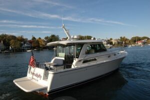 2019 Sabre 38 Salon Express stern or aerial exterior view showing aft deck, transom, and hull profile on the water in West...