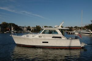 2019 Sabre 38 Salon Express main salon interior seating area with upholstered settee and forward cabin access
