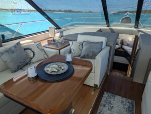 2020 Tiara Yachts F53 Flybridge flybridge helm station with dual helm seats, steering wheel, and instrument displays overl...