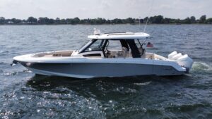 2022 Boston Whaler 350 Realm 35.5-foot center console yacht profile view showing white hull, hardtop, and helm station fro...