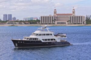 Bow view of 2022 Marlow Voyager 100 Series motor yacht with forward seating and windscreen in Fort Lauderdale.