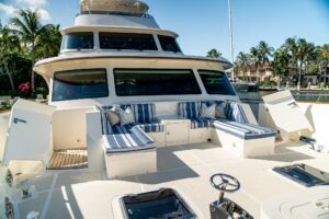2022 Marlow Voyager 100 Series 102-foot motor yacht helm station with dual Garmin displays and leather helm seating.