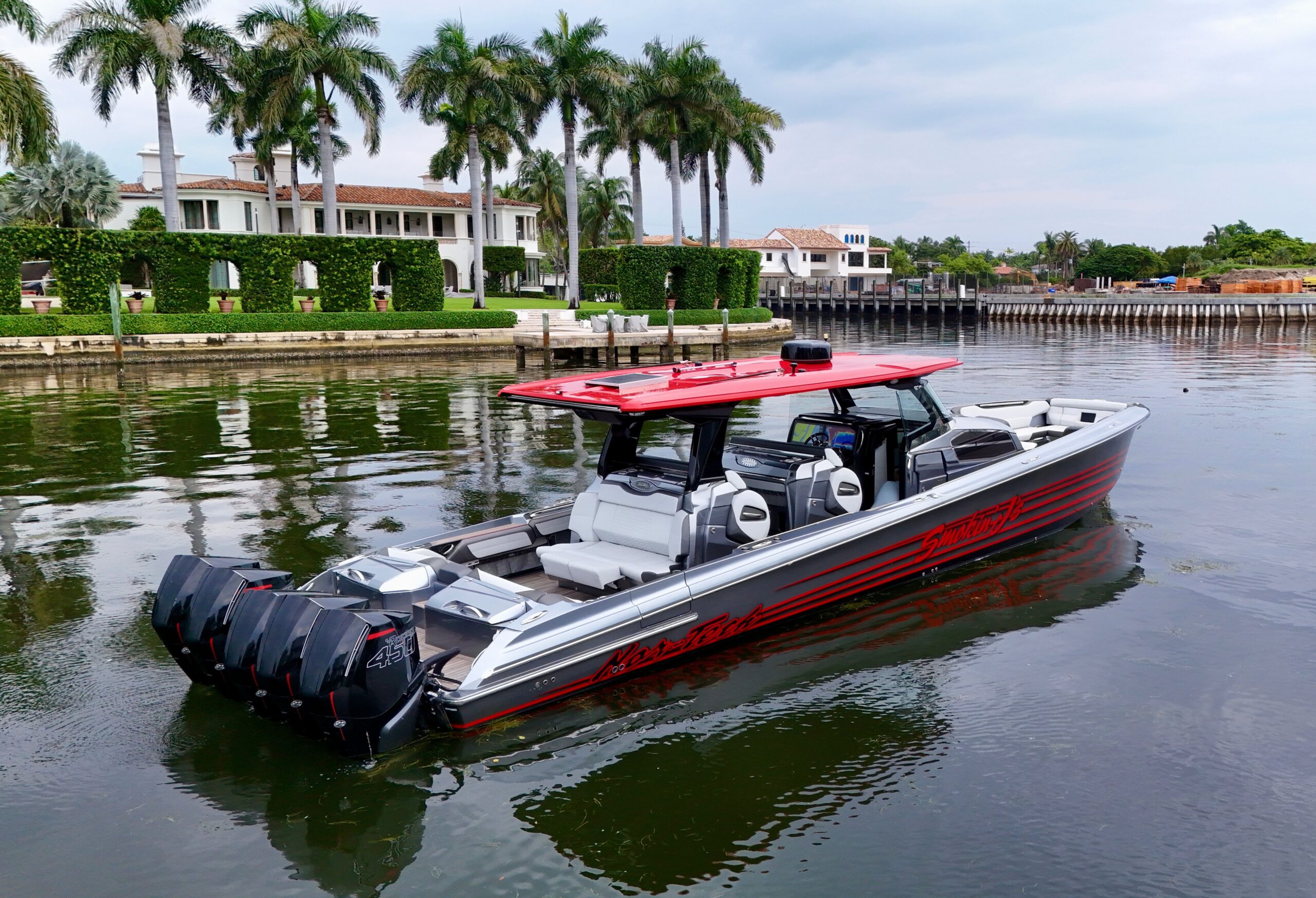 2022 Nor-Tech 50 Sport center console yacht profile view showcasing aggressive hull design and hardtop tower in Miami Beach.
