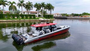 Nor-Tech 50 Sport helm station with dual Garmin displays, leather helm seat, and center console steering in Miami Beach.