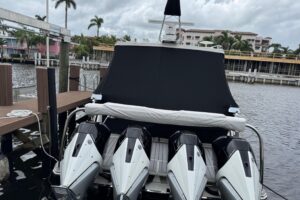 Bow view of 2023 Formula 400 Super Sport Crossover with forward seating and windshield, anchored in Fort Lauderdale waters.