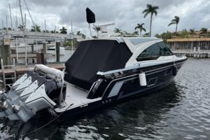 2023 Formula 400 Super Sport Crossover helm station with dual Garmin displays, leather helm seating, and center console st...