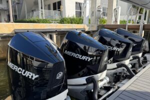 2023 Formula 400 Super Sport Crossover helm station with dual Garmin displays, leather helm seating, and center console st...