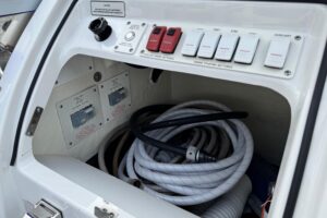 2023 Formula 400 Super Sport Crossover helm station with dual Garmin displays, leather helm seat, and center console steer...