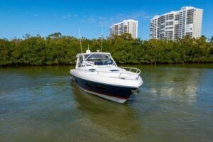 2023 Intrepid 438 Evolution 45-foot center console bow profile showing forward seating, hardtop, and outriggers at dock in...