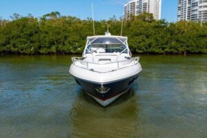 2023 Intrepid 438 Evolution 45-foot center console aerial or elevated stern quarter view showing hardtop, outriggers, and ...