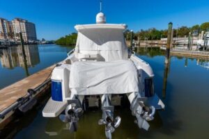 2023 Intrepid 438 Evolution center console cockpit seating and hardtop structure with outriggers visible from mid-vessel a...