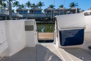 2023 Intrepid 438 Evolution center console cabin cruiser mid-ship profile showing hardtop, outriggers, and twin-level deck...