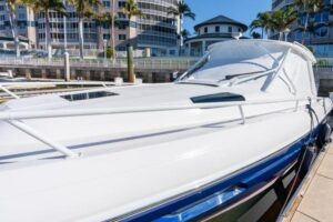 2023 Intrepid 438 Evolution center console cabin cruiser mid-ship profile showing hardtop, outriggers, and twin-level deck...