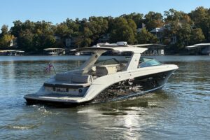 2023 Sea Ray SLX 400 sport yacht profile view showing 40-foot luxury cruiser with integrated hardtop and dual helm station...