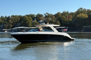 2023 Sea Ray SLX 400 bow seating area with forward-facing cushioned lounges and windscreen.