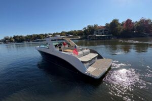 Sea Ray SLX 400 cabin cruiser with open cockpit seating and hardtop, Sunrise Beach Missouri.