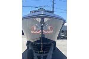 Bow seating and forward cabin entry on 2024 Fountain 38 SC center console with integrated cushioned loungers and windscree...