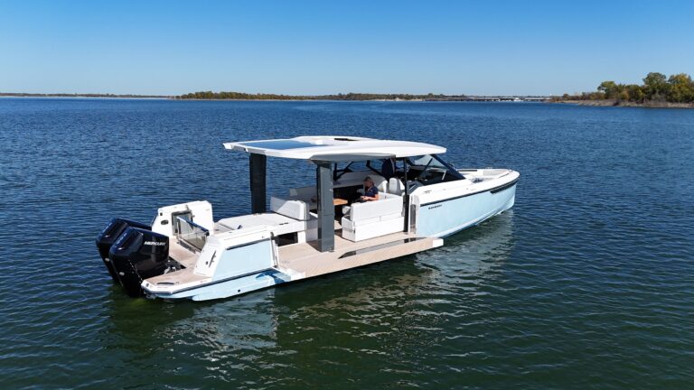 2025 Saxdor 400 GTO 41-foot open sport yacht cockpit seating area with wraparound upholstered lounge and center console he...