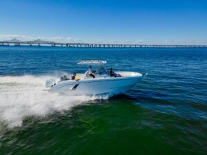 2026 Beneteau Flyer 9 SPACEdeck helm station with dual helm seats, steering wheel, and integrated Garmin electronics displ...