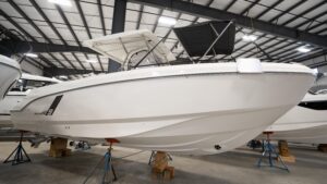 2026 Beneteau Flyer 9 SPACEdeck helm station with dual helm seats, steering wheel, and forward windscreen visibility.