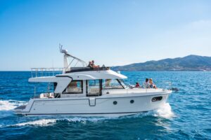 2026 Beneteau Swift Trawler 41 Fly exterior profile starboard side showing full-length trawler hull with hardtop and flybr...