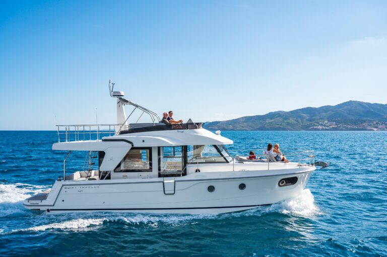 2026 Beneteau Swift Trawler 41 Fly exterior profile starboard side showing full-length trawler hull with hardtop and flybr...