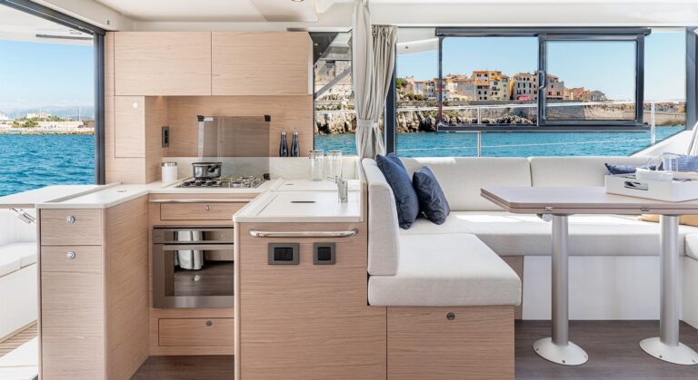 Beneteau Swift Trawler 41 Fly helm station with dual Garmin displays and center console steering in modern pilothouse design.