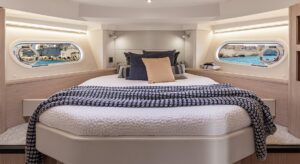 Beneteau Swift Trawler 41 Fly helm station with dual Garmin displays, steering wheel, and instrument panel overlooking the...
