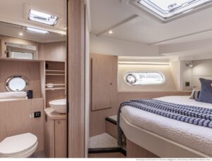 Beneteau Swift Trawler 41 Fly helm station with dual Garmin displays, steering wheel, and overhead hardtop in the pilothouse.